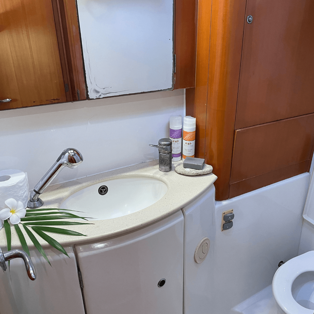 En-suite bathroom on a catamaran with fresh towels and toiletries