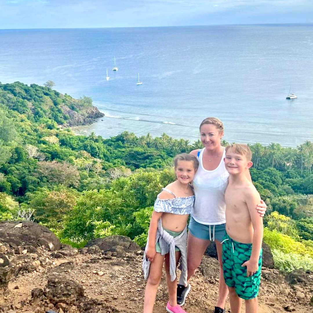 Parents teaching their children about sailing on a yacht charter in Fiji