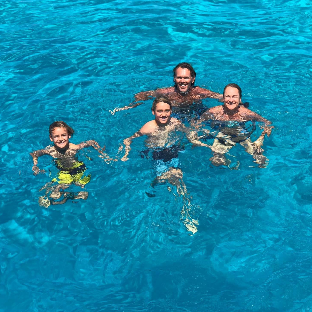 Kids enjoying water sports from a Fiji catamaran charter